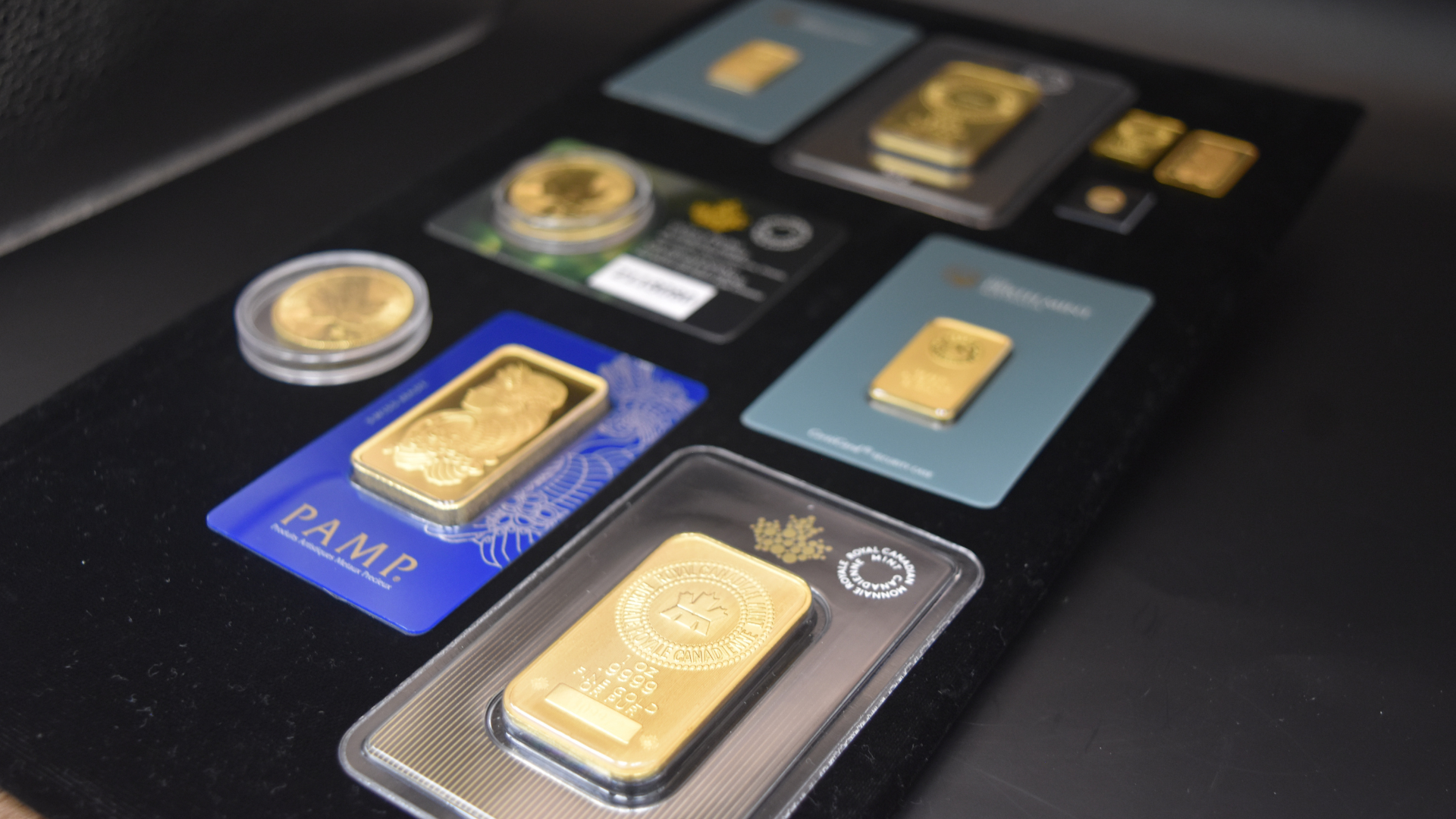 Variety of gold bars and Canadian Gold Maple Leafs